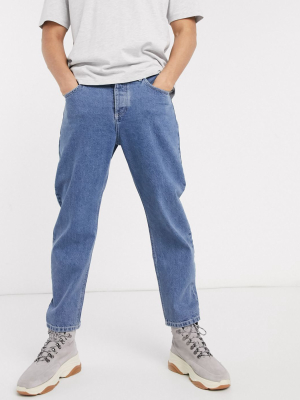 Asos Design Relaxed Tapered Jeans In Mid Wash Blue