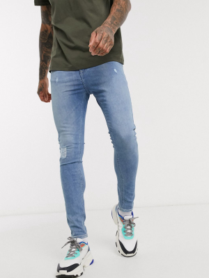 Asos Design Spray On Jeans With Power Stretch In Light Wash With Abrasions