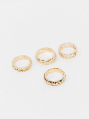 Asos Design Pack Of 4 Rings In Mixed Texture And Cut-out Roman Numerals In Gold Tone