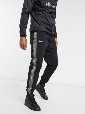 Ellesse Nylon Sweatpants With Reflective Piping In Black