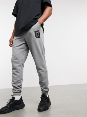 Puma Hoops Slim Logo Sweatpants In Gray