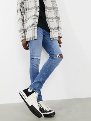 Asos Design 'responsible Edit' Skinny Jeans In Mid Wash With Knee Rips