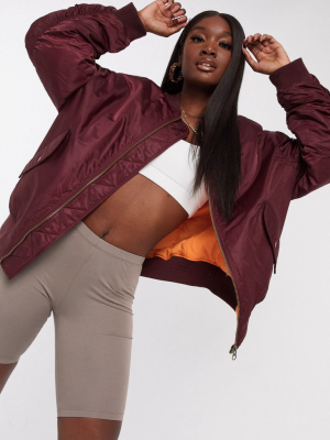 Asos Design Oversized Bomber Jacket With Sleeve Detail In Oxblood