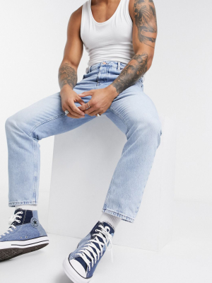 Asos Design Relaxed Tapered Jeans In Light Blue Stone Wash