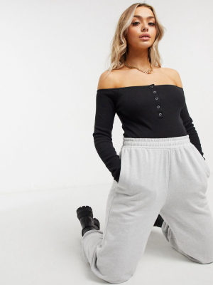 Missguided Long Sleeve Rib Bodysuit With Button Detail In Black