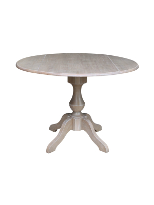 Kayden Round Dual Drop Leaf Pedestal Table Washed Gray Taupe - International Concepts