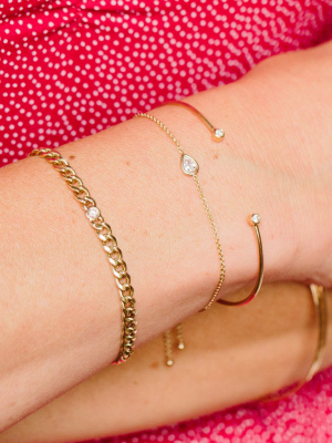 14k Medium Curb Chain Bracelet With Single Floating Diamond