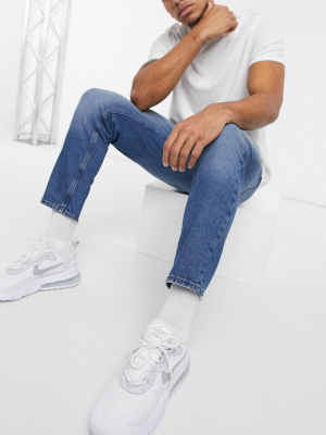 Asos Design Classic Rigid Jeans In Dark Blue Tint