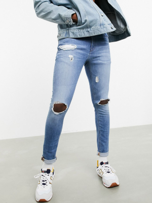 Asos Design 'responsible Edit' Superskinny Jeans In Mid Wash With Knee Rips