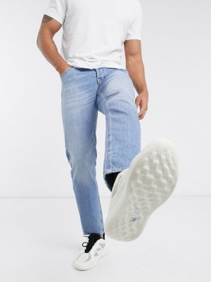 Asos Design Stretch Tapered Jeans In Vintage Light Wash Blue