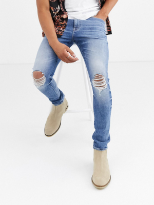 Asos Design 12.5oz 'cigarette' Skinny Jeans In Mid Wash Blue With Busted Knees