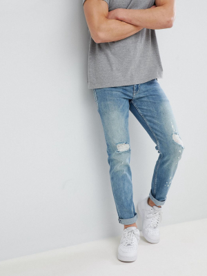 Asos Design Stretch Slim Jeans In Mid Wash Blue With Rips