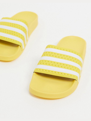 Adidas Originals Adilette Sliders In Yellow
