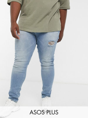 Asos Design Plus Skinny Jeans In Vintage Light Wash Blue With Thigh Rip