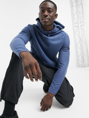 Asos Design Polar Fleece Hoodie With Funnel Neck Bungee Details & Badge In Washed Blue