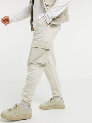 Asos Design Tapered Cargo Sweatpants With Woven Cargo Pockets In Beige
