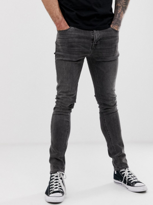 Asos Design Super Skinny Jeans In Washed Black