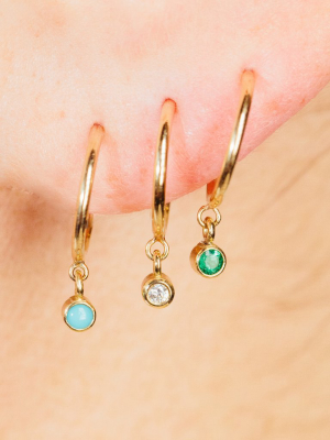 14k Dangling Emerald Huggie Hoops | May Birthstone