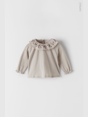 Embroidered Ruffled Collar Top