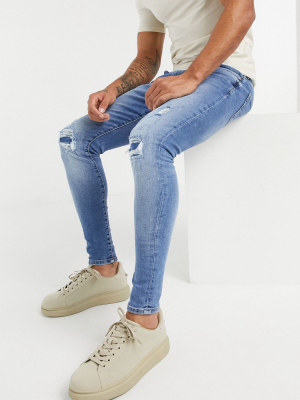 River Island Spray On Ripped Jeans In Midwash Blue