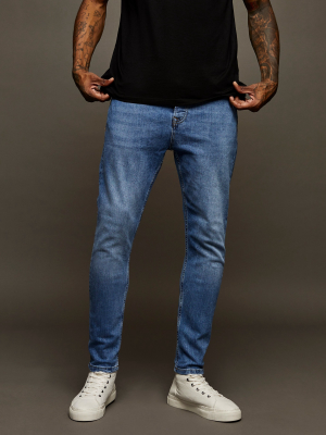 Mid Wash Tapered Jeans