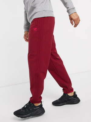 Adidas Originals Winterized Sweatpants With 3 Stripes In Burgundy Tech Pack