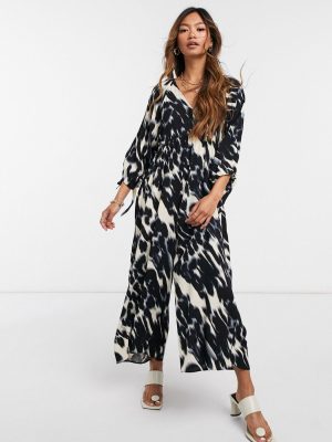 Asos Design Smock Jumpsuit With Tie Sleeve Detail In Blurred Animal Print