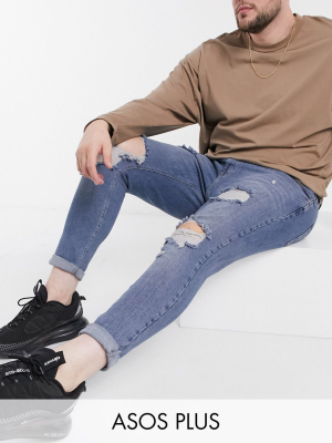 Asos Design Plus Spray-on Vintage Look Jeans With Power Stretch In Mid Blue With Heavy Rips