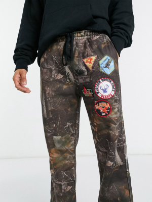 Jaded London Sweatpants With Badges In Woodland Print