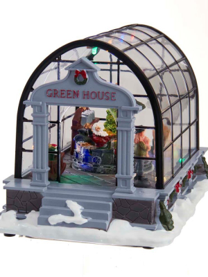 Kurt Adler 5.5" Battery-operated Led Musical Green House And Santa Table Piece