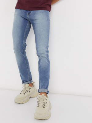 Asos Design Skinny Jeans In Classic Mid Wash Blue