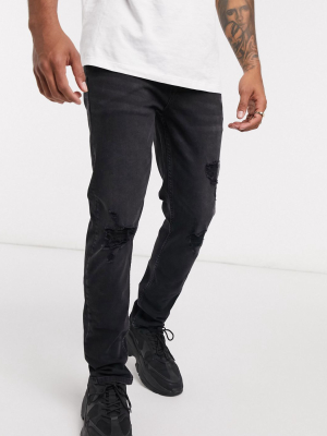 Asos Design Skinny Jeans In Washed Black With Knee Rips