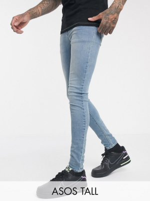 Asos Design Tall Spray On Jeans In Power Stretch Denim In Light Wash