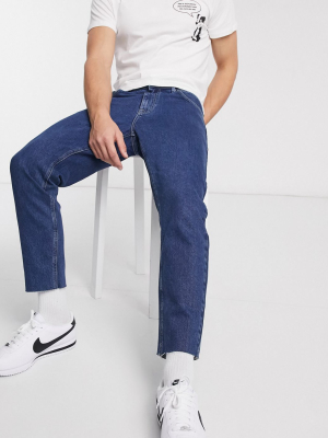 Asos Design Classic Rigid Jeans In Mid Wash Blue With Raw Hem