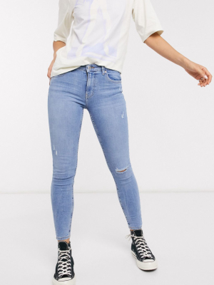 Bershka Super Skinny 5 Pocket Jeans In Medium Blue With Knee Rip