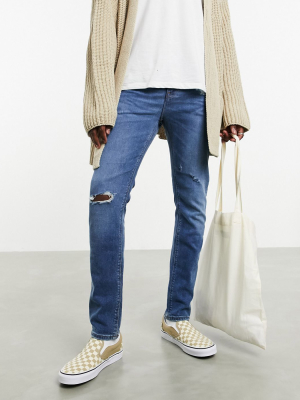 Asos Design 'responsible Edit' Skinny Jeans In Mid Wash With Rips