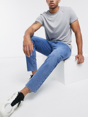 Asos Design Classic Rigid Jeans In Sustainable Dark Wash Blue With Raw Hem