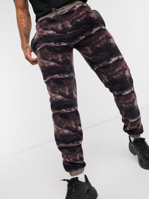 Asos Design Set Tapered Sweatpants In Fleece And All Over Print