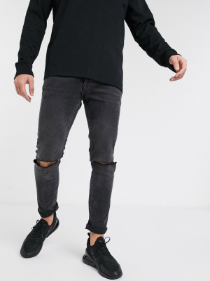 Topman Skinny Jeans With Knee Rips In Washed Black