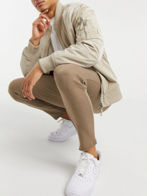 Asos Design Skinny Sweatpants With Raw Hem & Zip Pockets In Brown