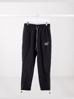 Puma King Logo Zip Trackpants In Black