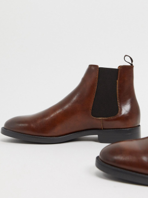 Asos Design Chelsea Boots In Brown Faux Leather With Black Sole