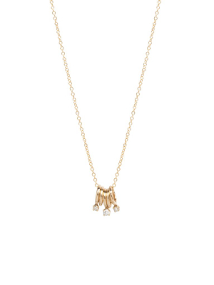 14k 5 Tiny Rings Necklace With 3 Prong Diamonds