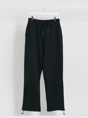 Asos Design Super Oversized Sweatpants In Black With Toggle Hem