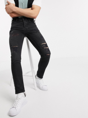 Topman Organic Skinny Jeans With Rips In Black