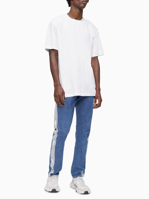 Slim Fit Light Wash Logo Tape Jeans