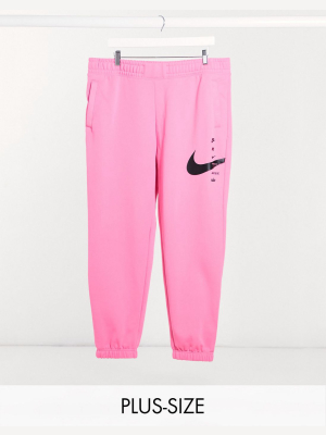 Nike Plus Swoosh Oversized Sweatpants In Pink