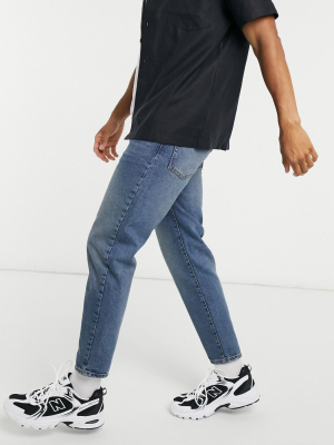 Asos Design Classic Rigid Jeans In Vintage Dirty Wash Blue