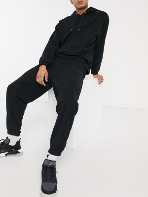 Asos Design Co-ord Oversized Polar Fleece Sweatpants In Black