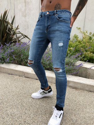 Asos Design Spray On'vintage Look' Jeans With Power Stretch In Dark Wash Blue With Abrasions